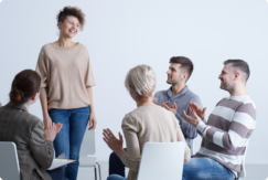 Types of Therapy: Woman engaging in group therapy