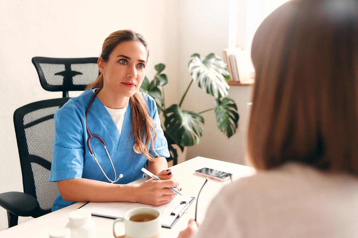 A doctor speaks with a potential patient who is considering inpatient rehab.