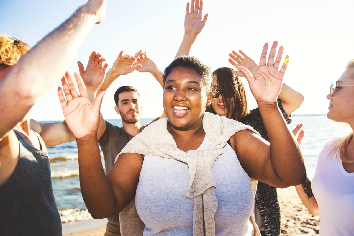 A woman experiencing the benefits of CBT with a group of peers.