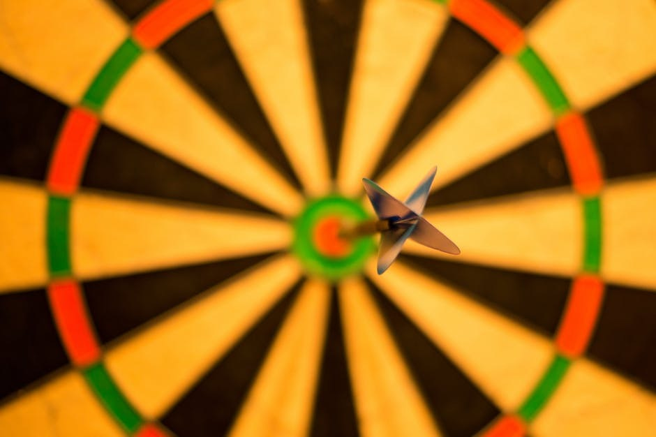 Picture of a dartboard with a dart in the bullseye.