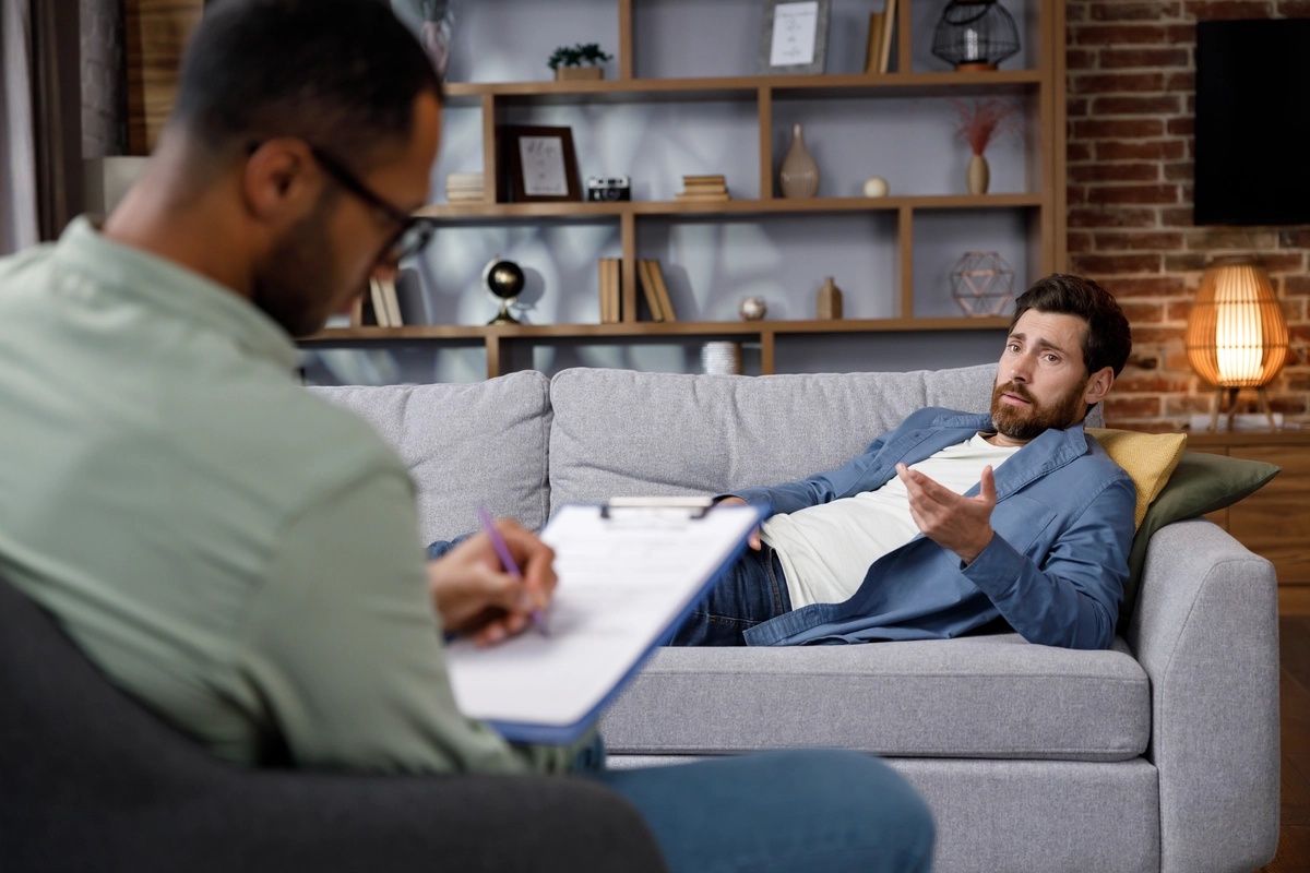 A man in a therapy session to treat his sex addiction.