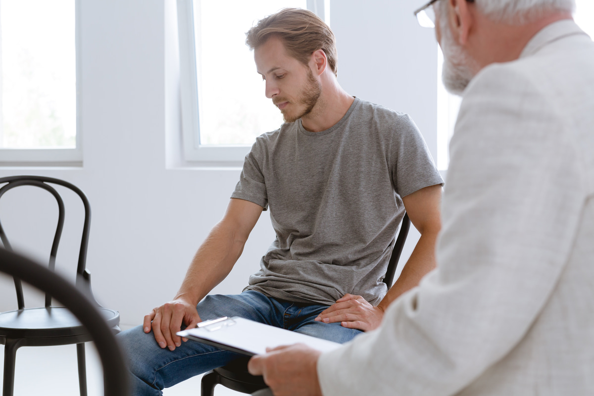 A man in an EMDR session with a therapist.