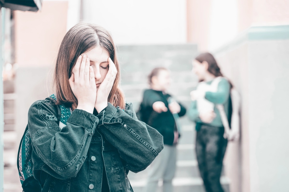 A woman struggling to interact with others socially, possibly suffering from social anxiety disorder.