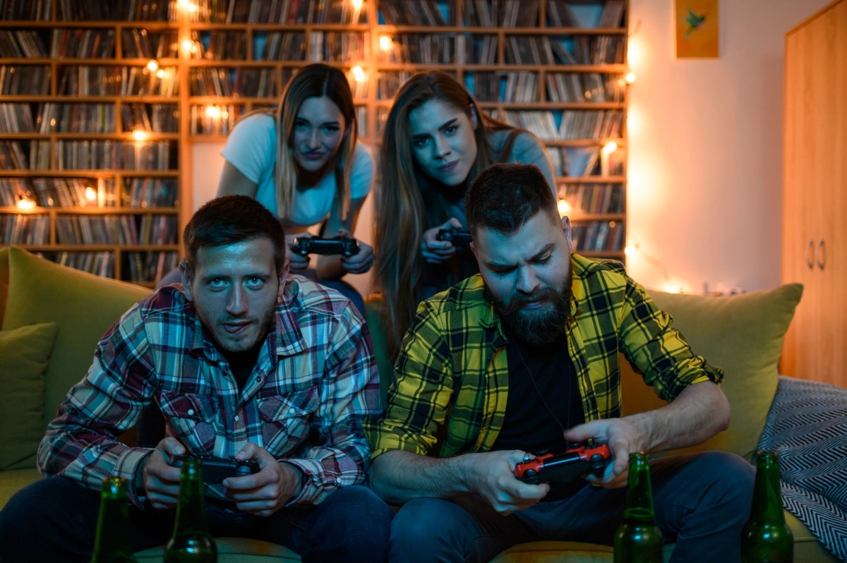 A group of friends playing video games, potentially suffering from video game addiction.