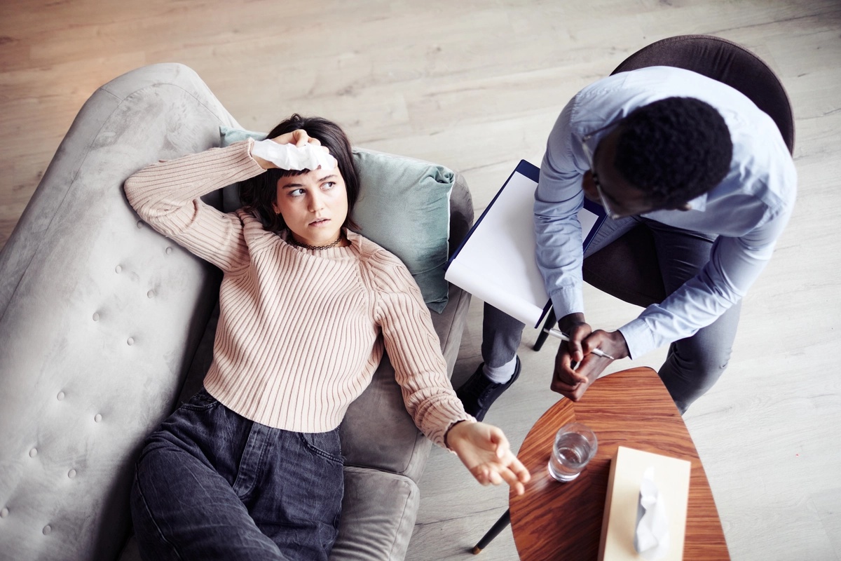 A woman in a motivational interviewing session with a counselor.