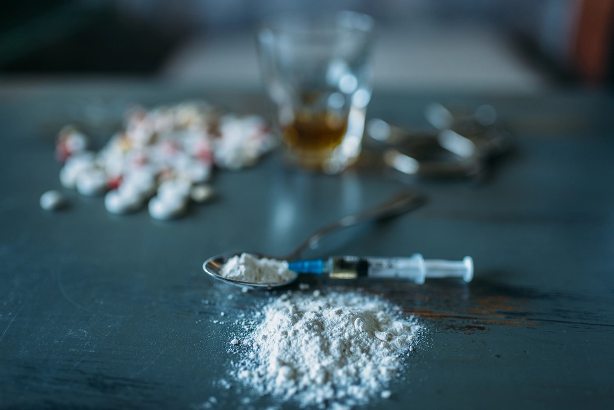 One of the symptoms of cocaine addiction is the presence of drug paraphernalia, such as needles and pills.