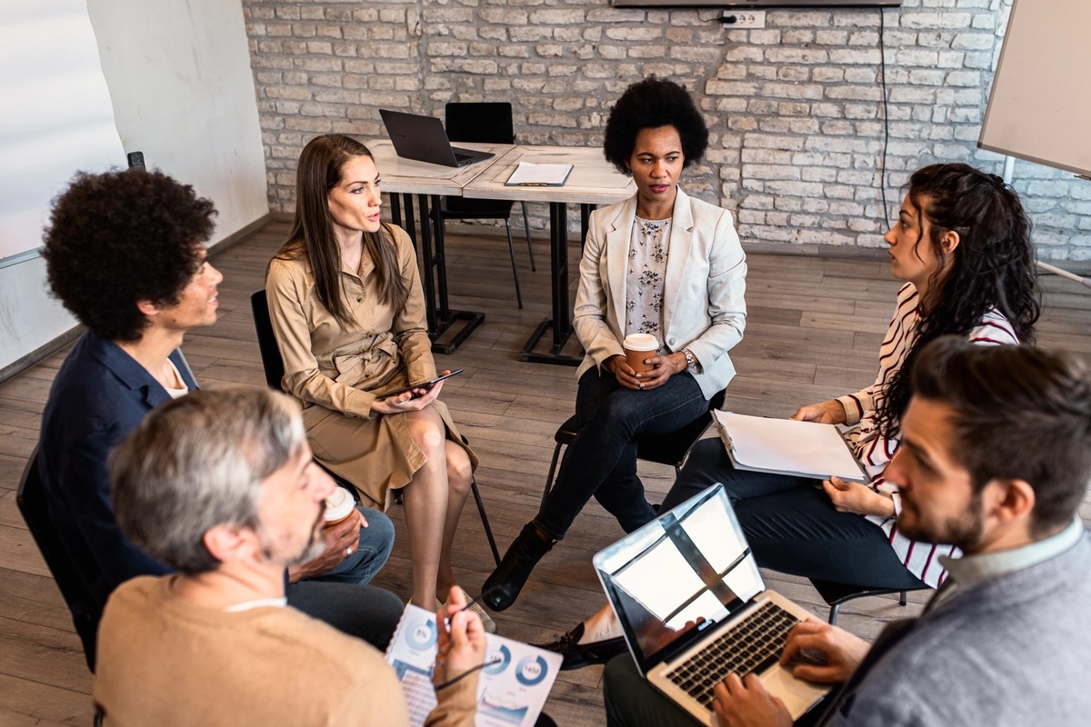 A group of case managers sitting in a circle.