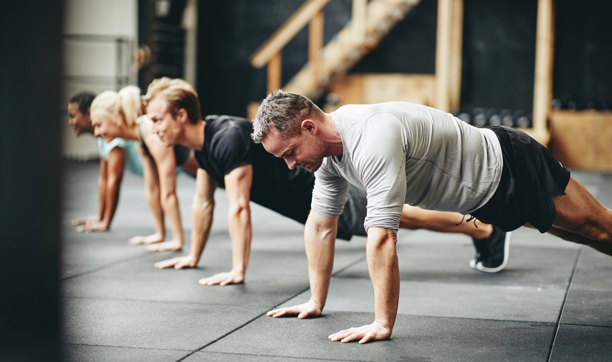 A group of people doing push-ups.