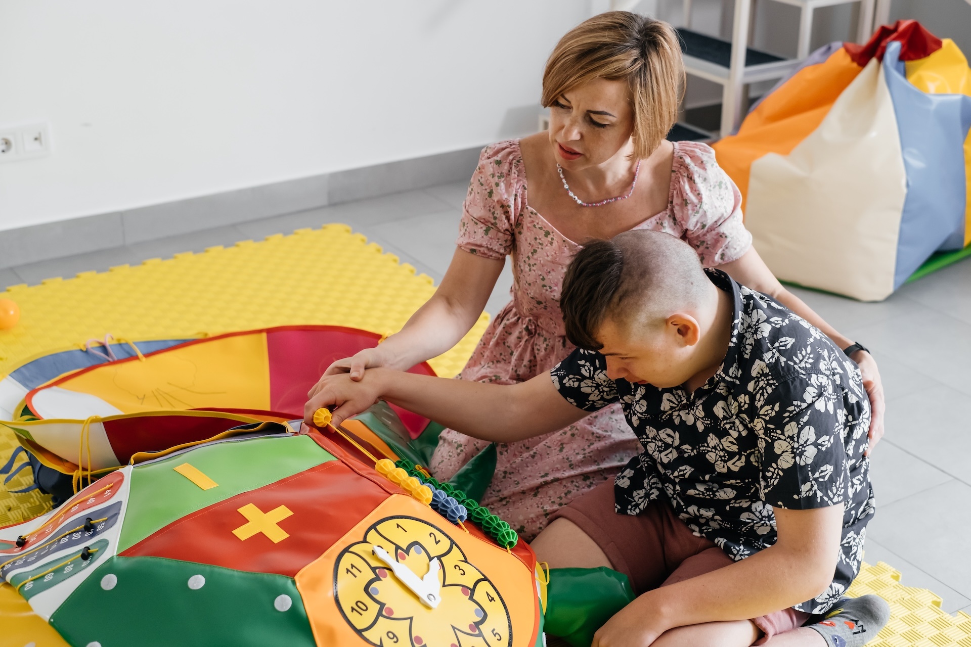 disabled-child-doing-sensory-activity-with-toys-r-2023-11-27-04-50-11-utc