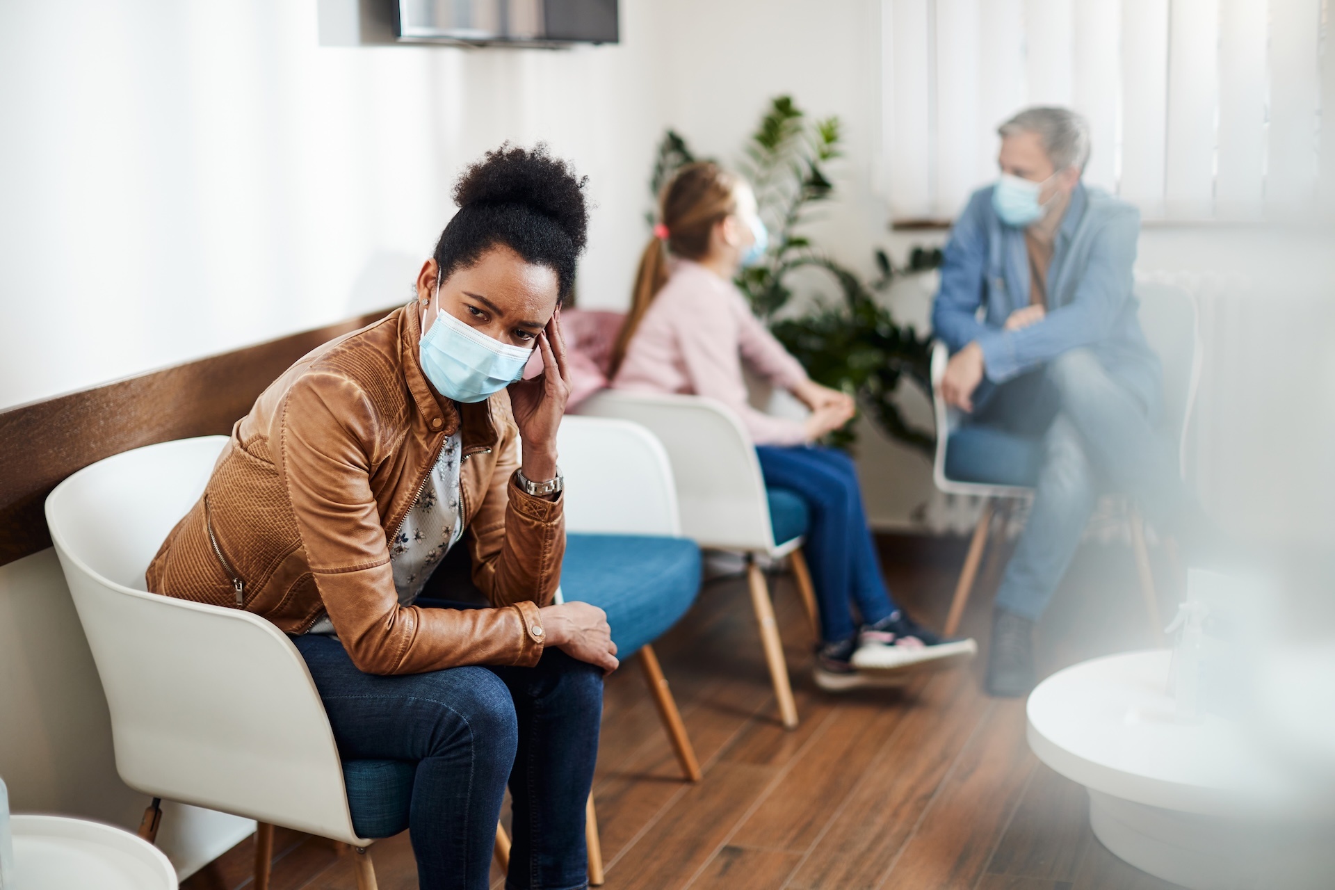 pensive-black-woman-wearing-face-mask-while-waitin-2024-12-13-17-40-57-utc