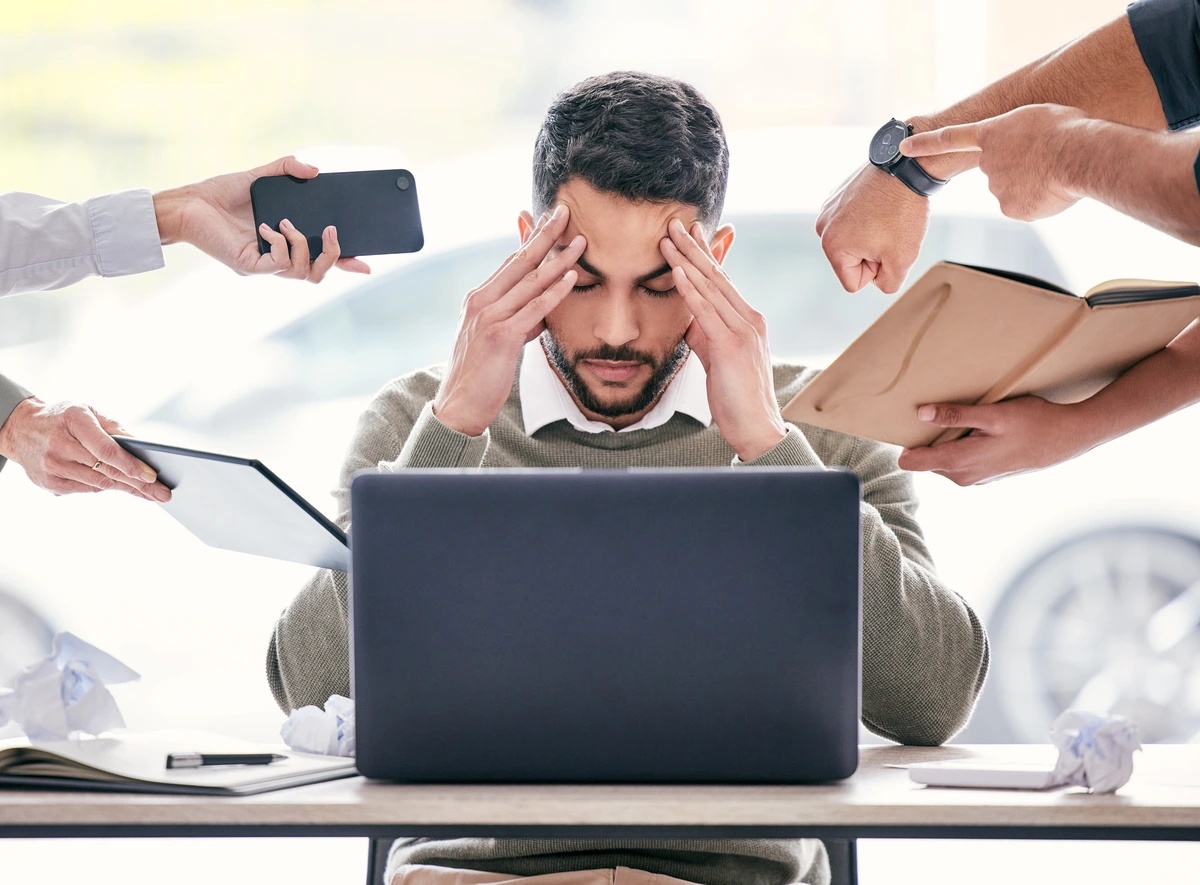 Adjustment Disorder A man feeling overwhelmed by responsibilities and change, reflecting symptoms of adjustment disorder.