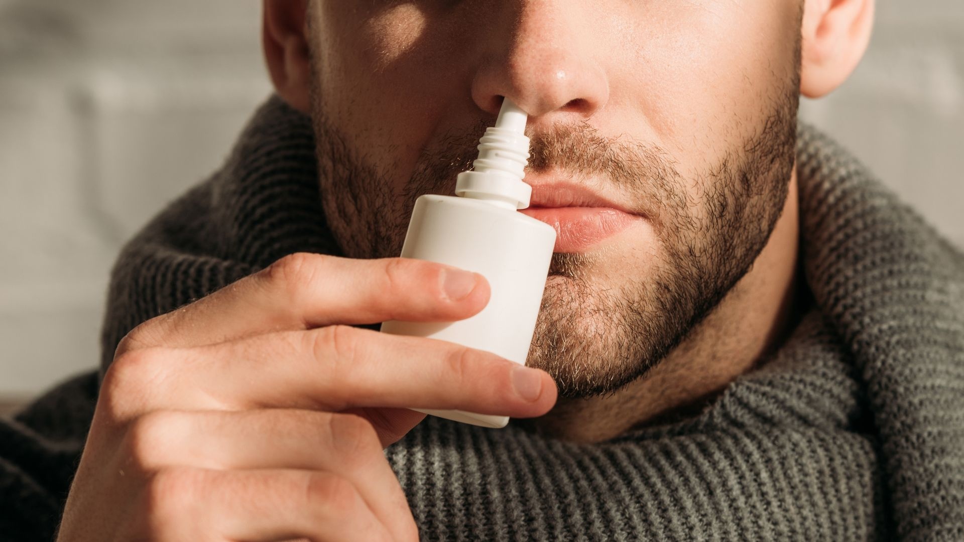 Afrin addiction: man sniffing afrin Afrin addiction: man sniffing afrin