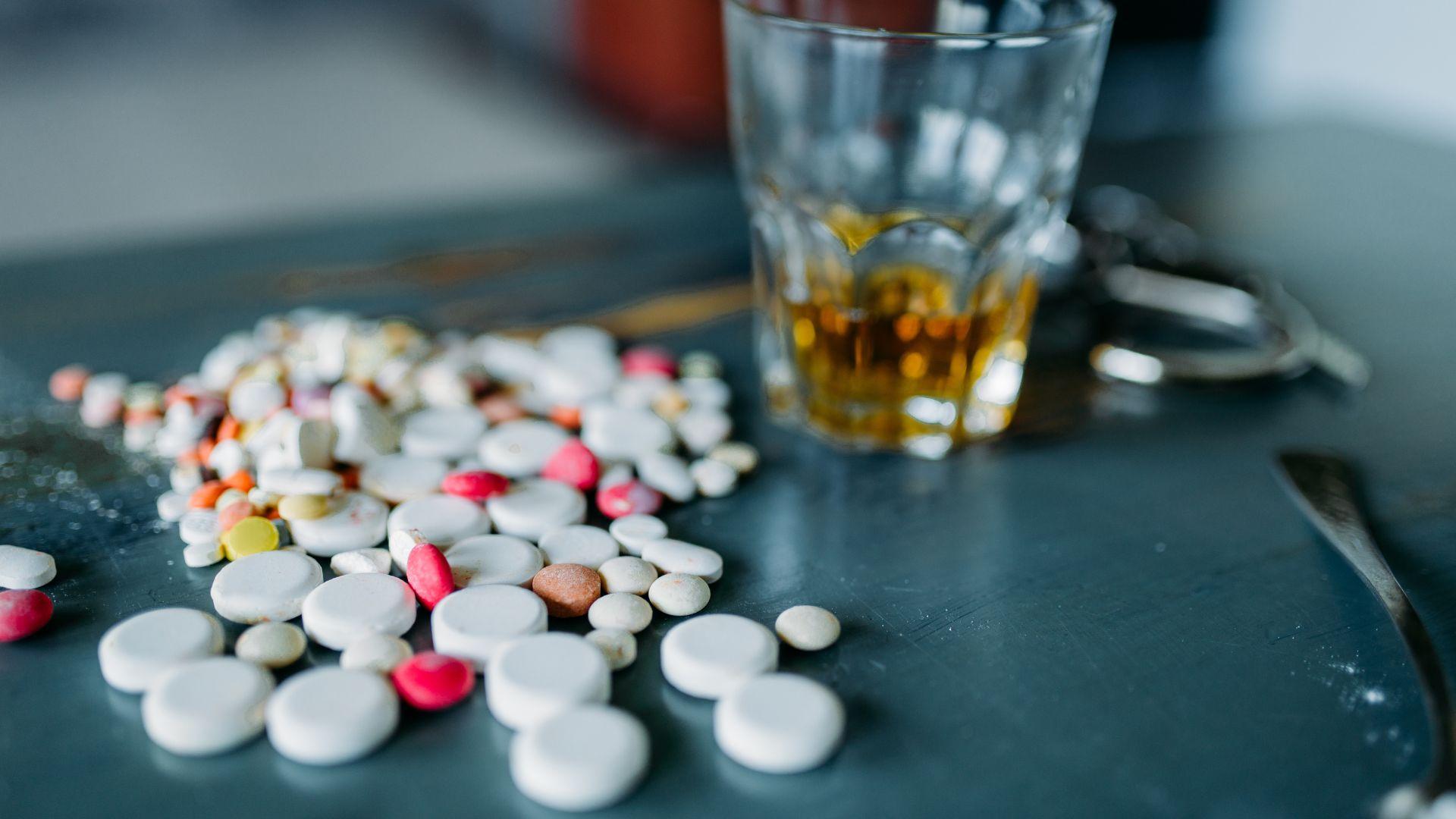 Signs of vyvanse addiction. Pills on the table with a drink