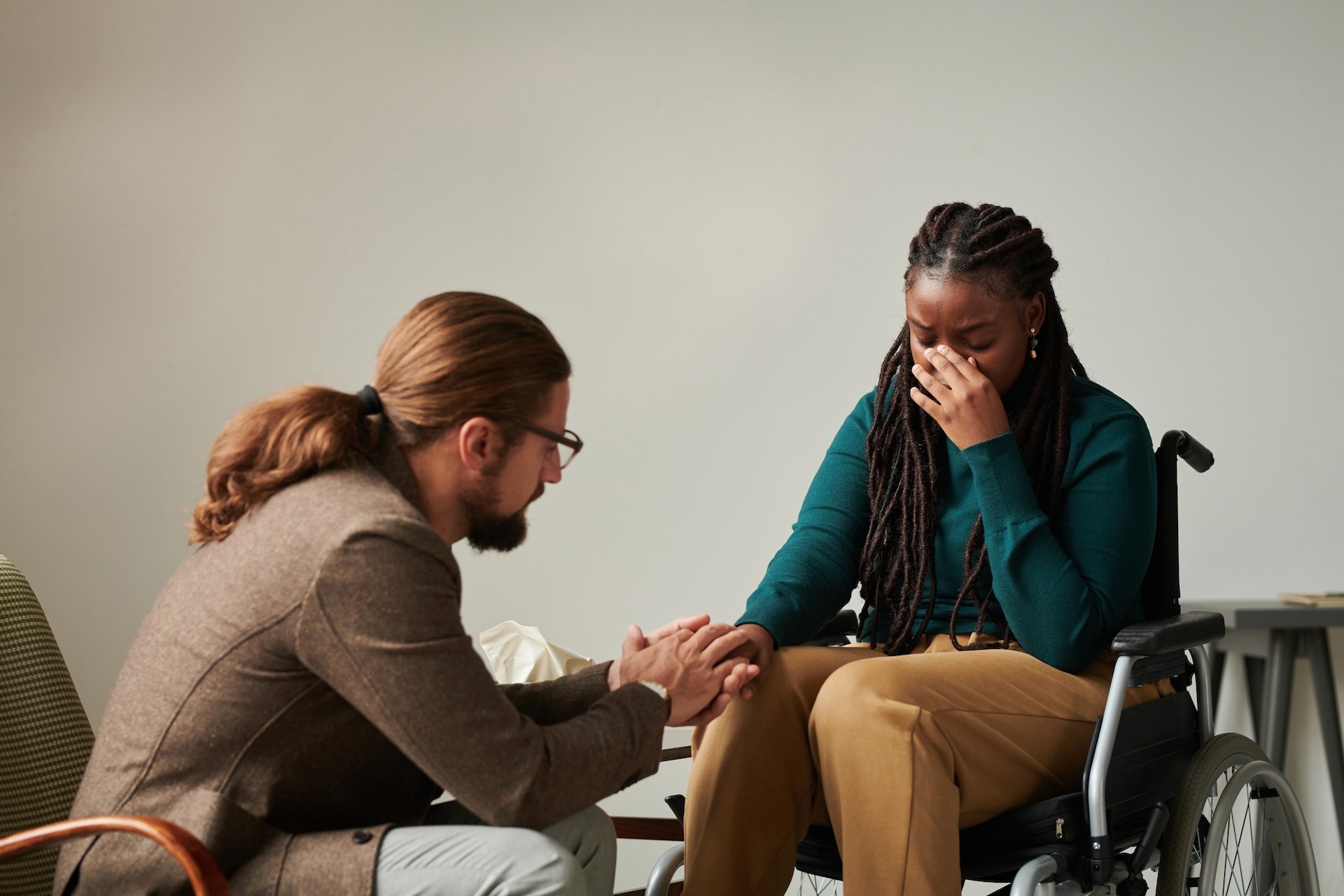 therapist-supporting-patient-with-disability-2023-11-27-05-20-33-utc