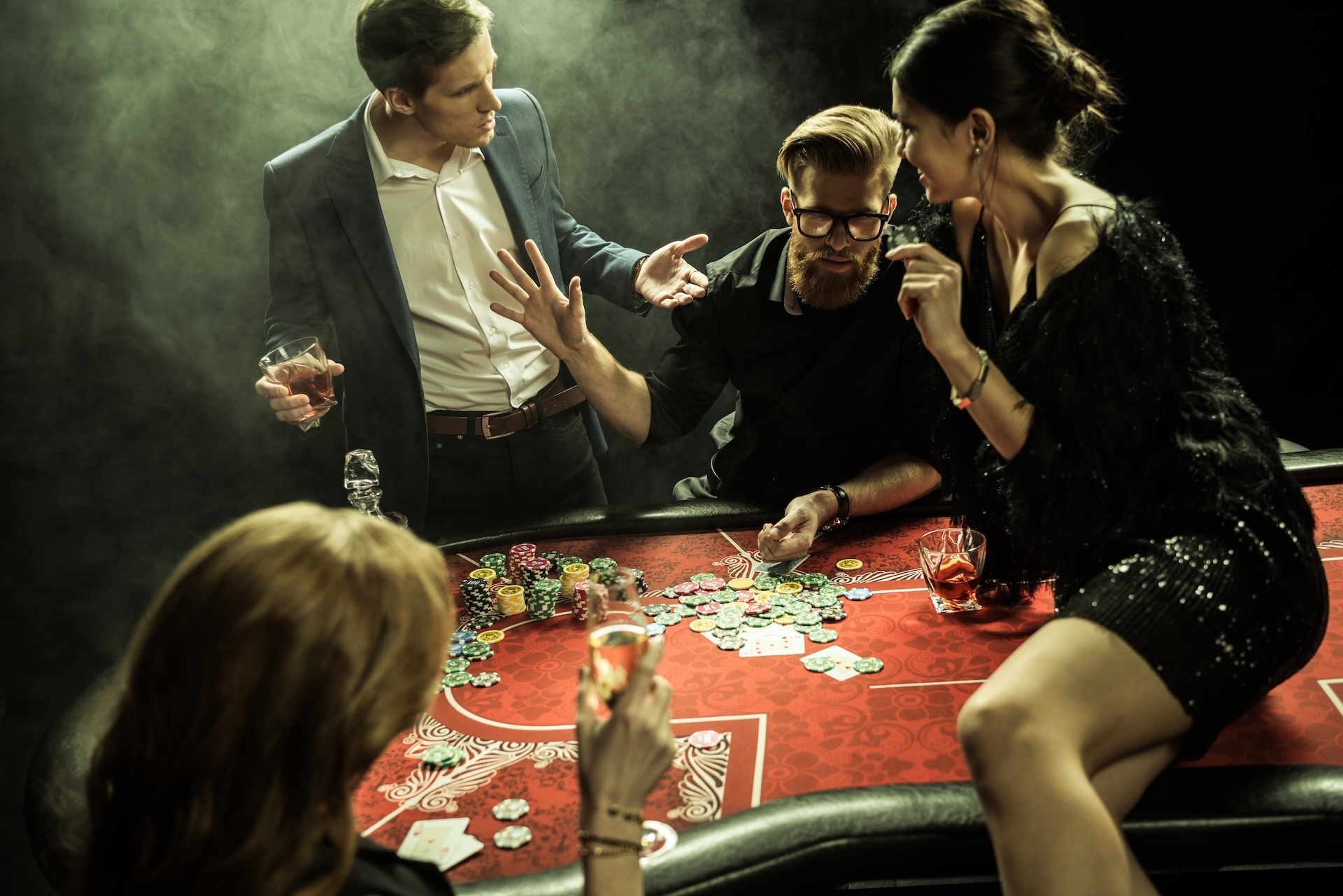 side-view-of-group-of-people-playing-poker-togethe-2024-11-08-12-22-41-utc