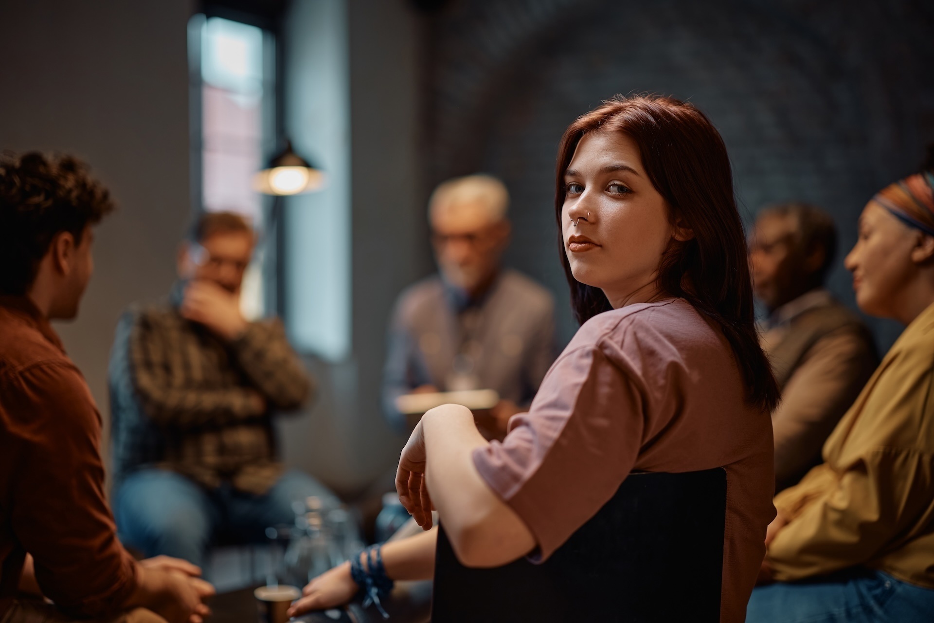 young-woman-attending-group-therapy-at-mental-heal-2025-02-23-16-51-34-utc