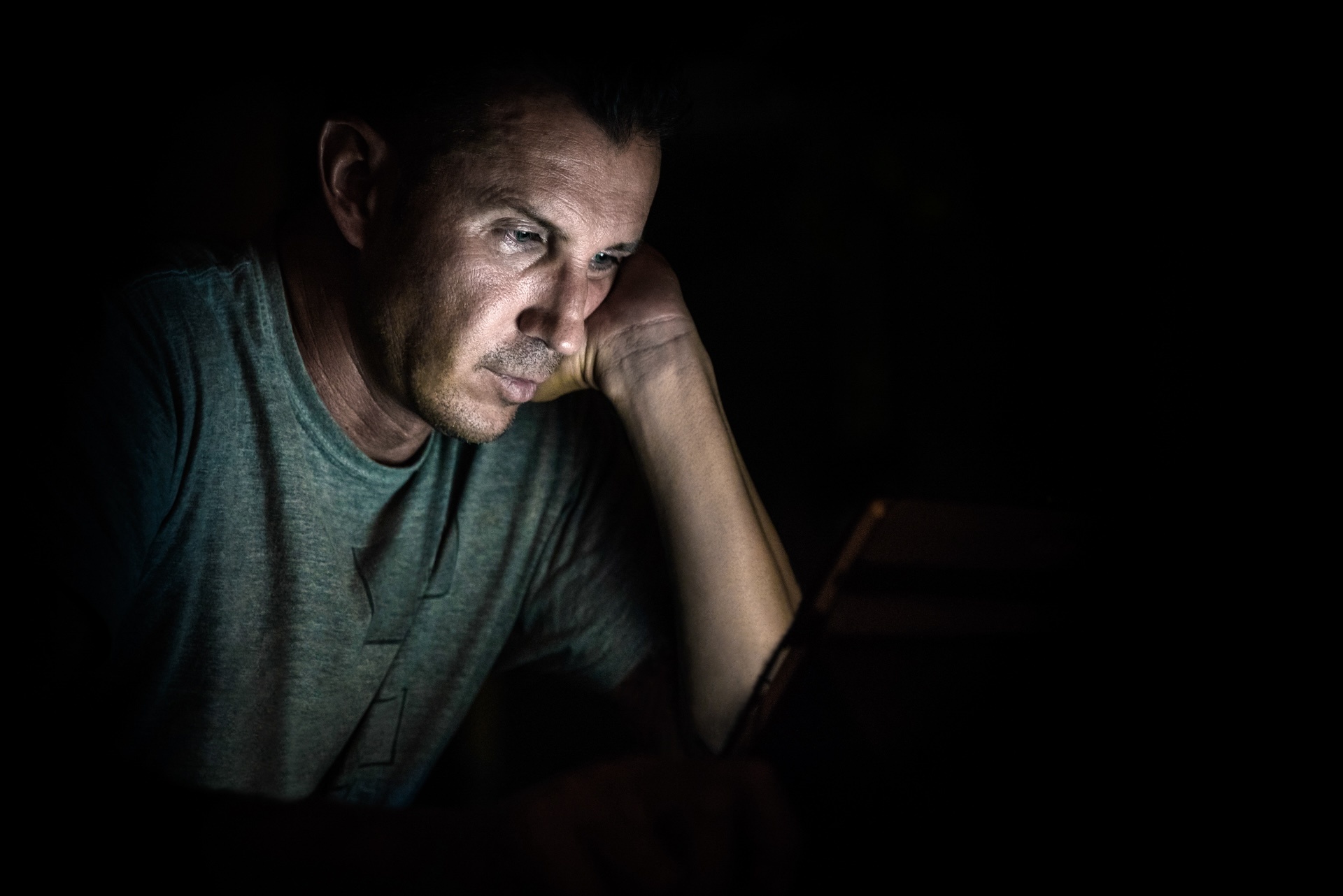 young-handsome-man-at-laptop-computer-with-light-r-2024-07-03-02-44-15-utc