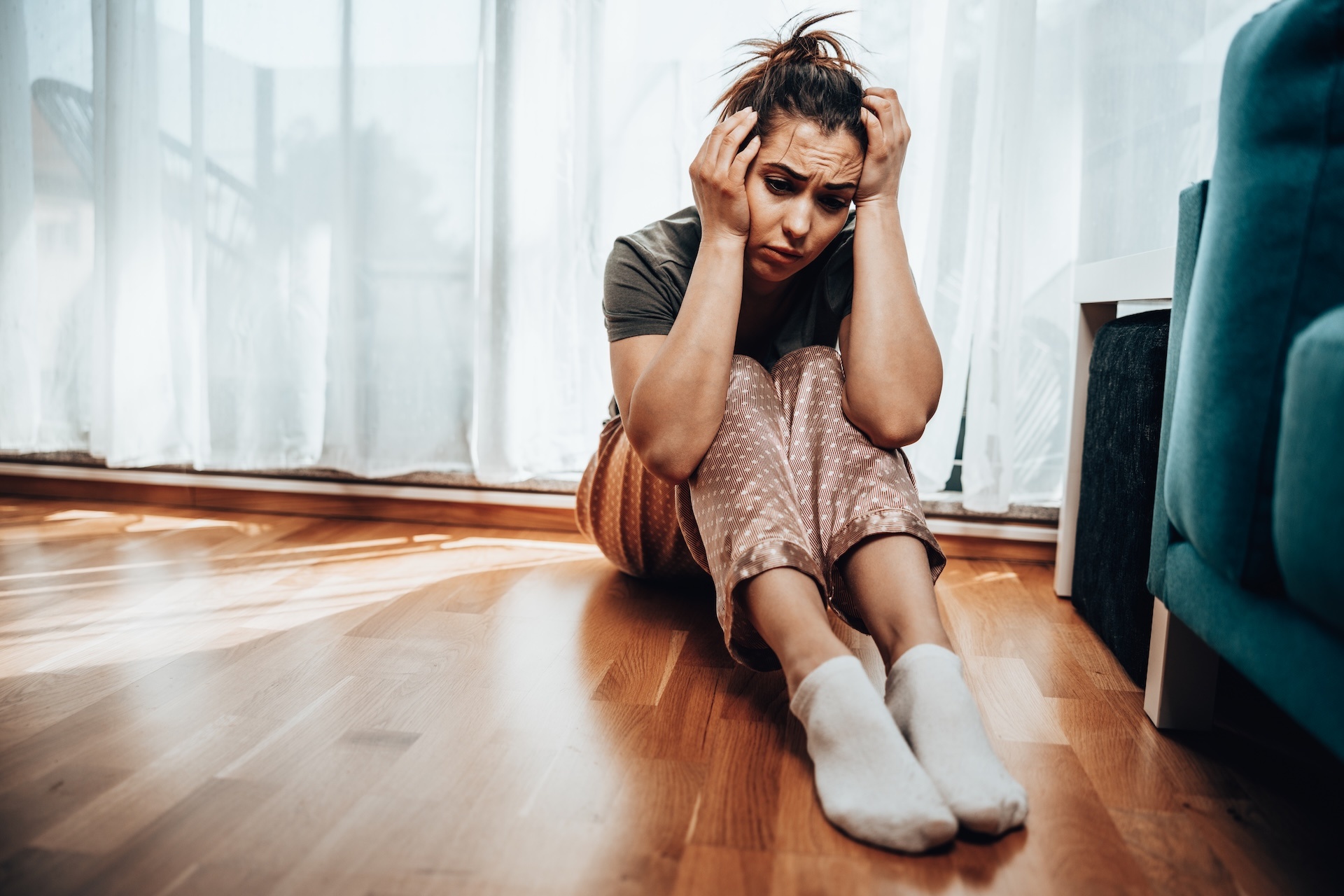 woman-feeling-worried-while-sitting-near-the-windo-2024-10-18-08-33-54-utc