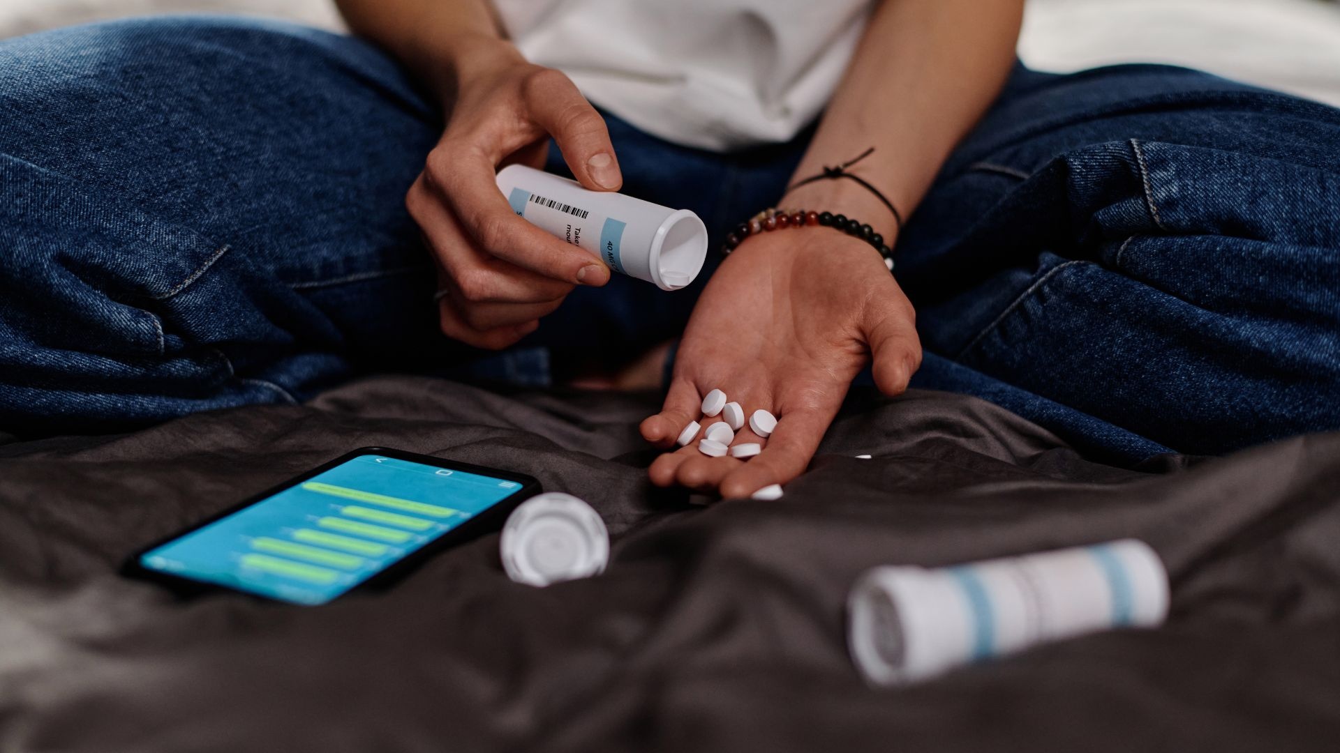 Oxycontin symptoms: man with hand full of of oxycontin pills. Oxycontin symptoms: man with hand full of of oxycontin pills.