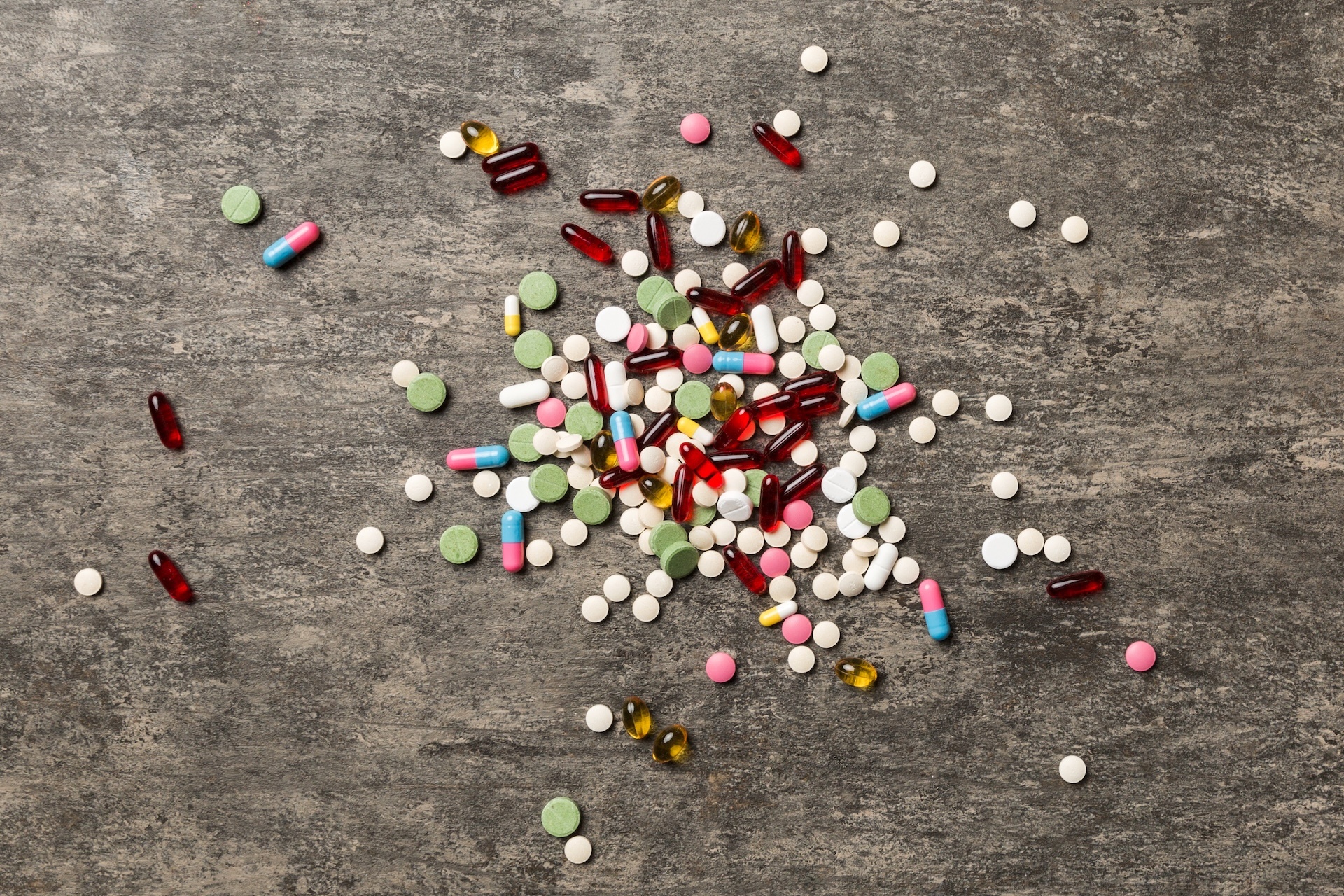 assorted-pills-and-tablets-top-border-over-colored-2025-03-10-14-33-04-utc