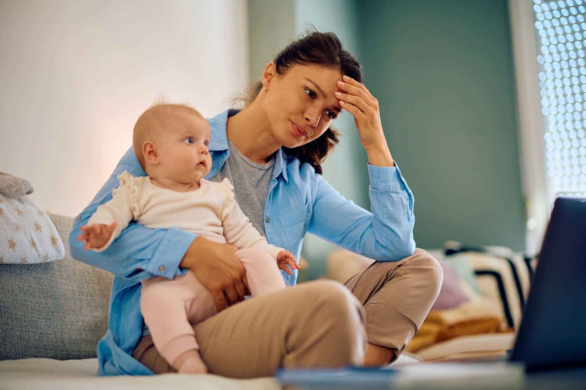 stay-at-home-mother-feeling-tired-while-trying-to-2023-11-27-04-56-28-utc