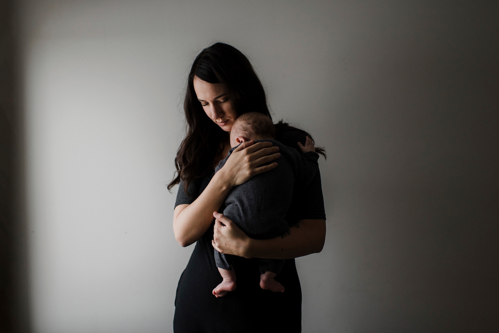 a-tender-moment-as-a-mother-cradles-her-sleeping-b-2024-07-03-16-39-23-utc