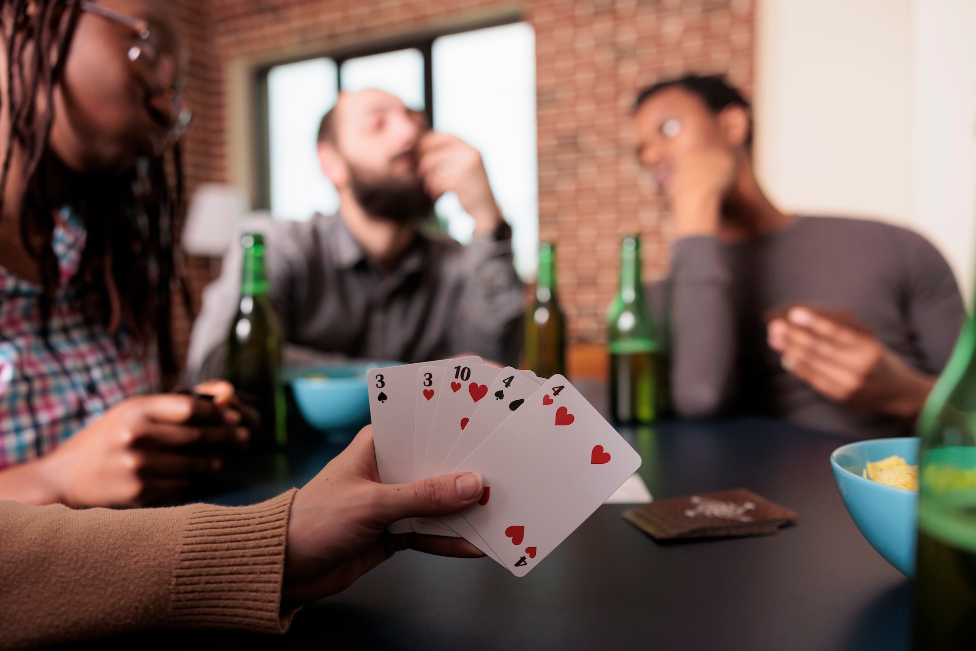 close-up-shot-of-woman-hand-holding-card-games-whi-2023-11-27-05-37-15-utc