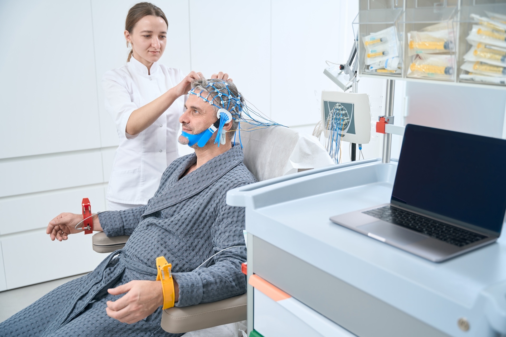 employee-of-a-medical-clinic-is-diagnosing-eeg-e-2023-11-27-05-04-15-utc