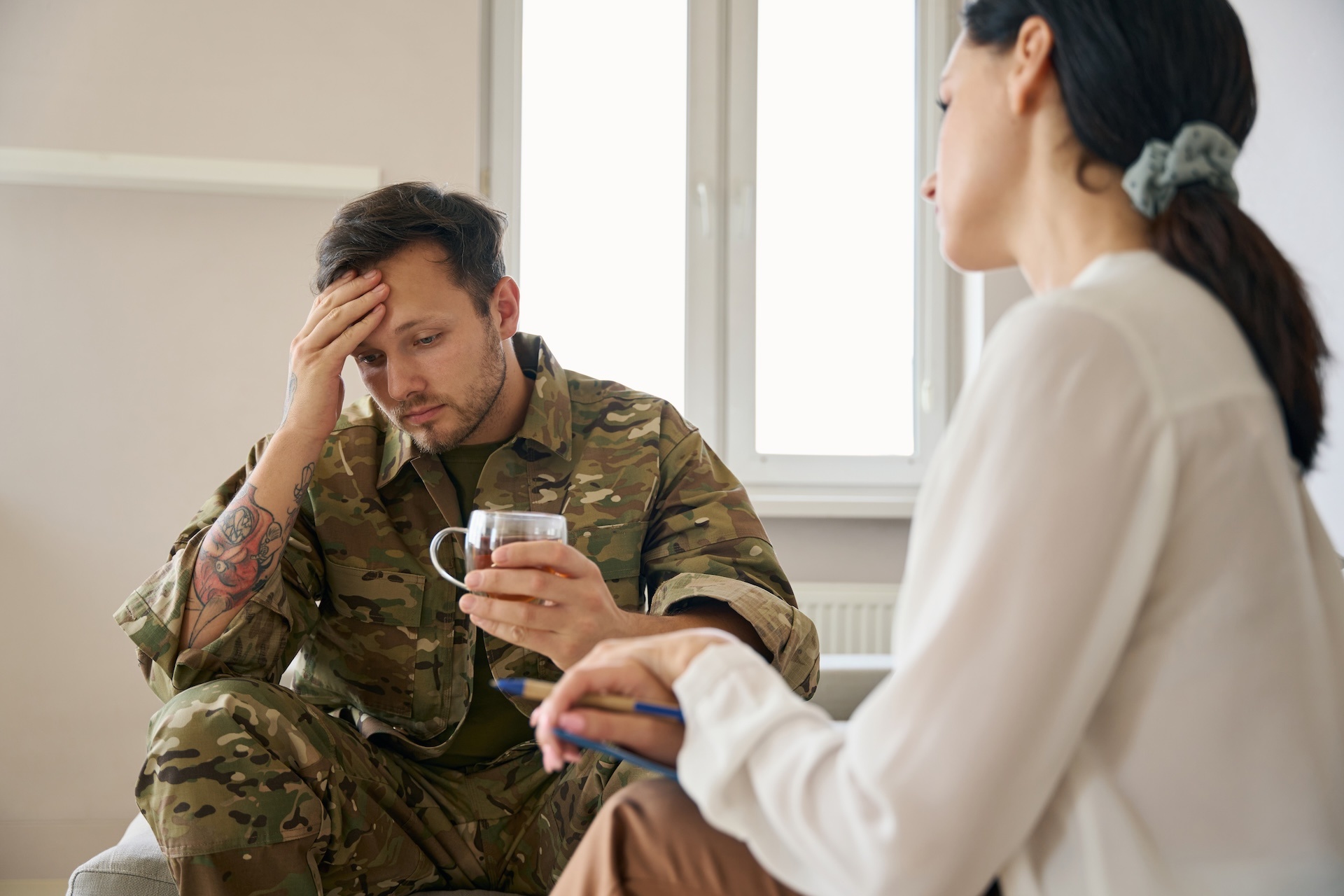 military-man-at-a-psychologist-s-reception-in-a-br-2024-10-22-07-40-42-utc