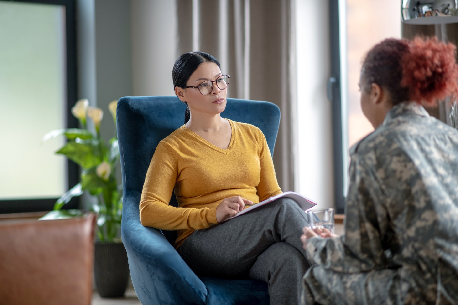 psychoanalyst-listening-to-woman-wearing-military-2024-10-15-00-45-42-utc