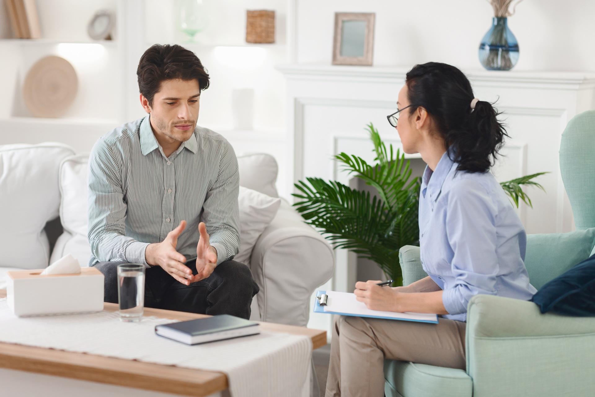 man-receiving-counseling-from-therapist-in-a-cozy-2024-06-12-02-52-24-utc