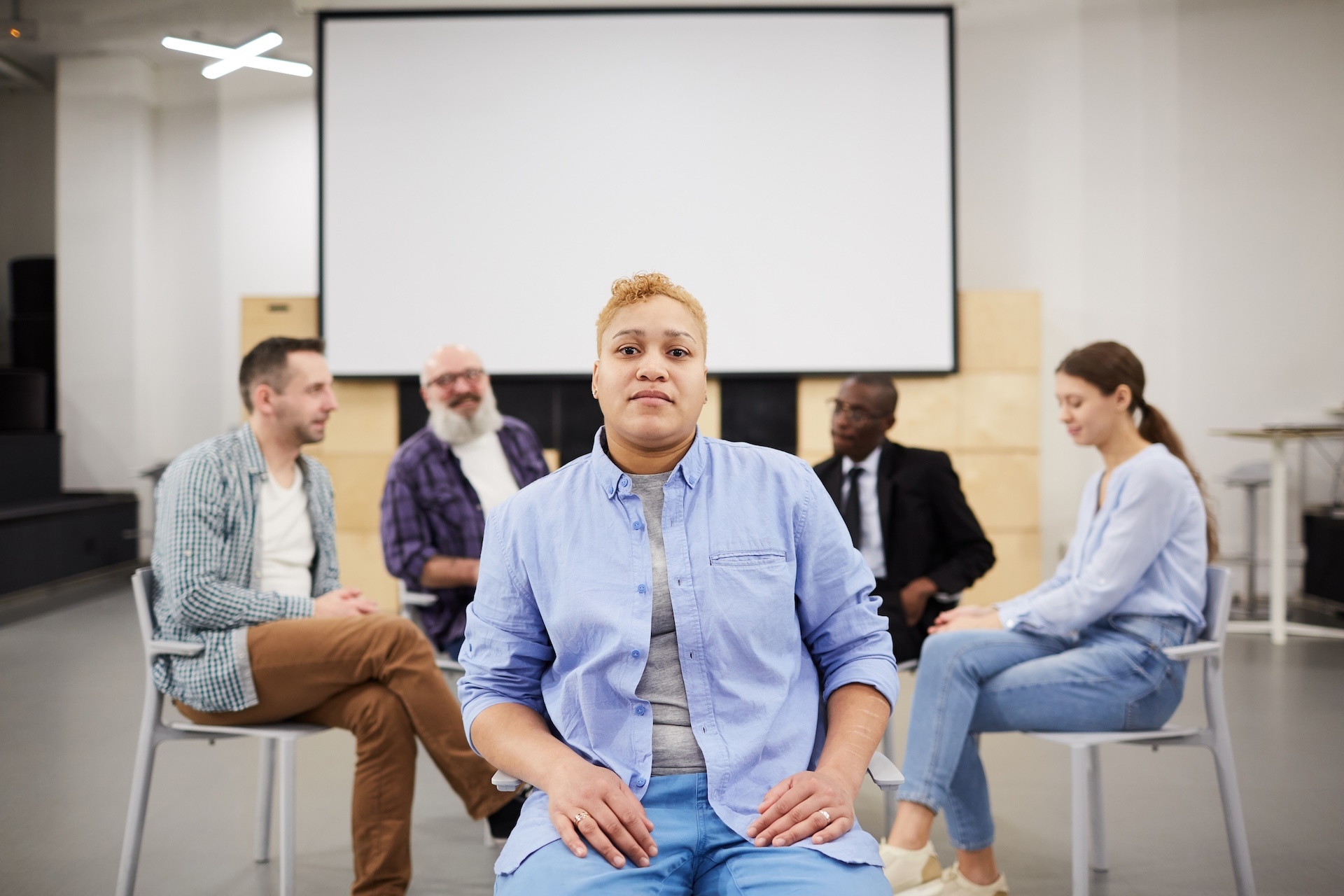 woman-posing-in-group-therapy-2025-03-07-22-29-13-utc
