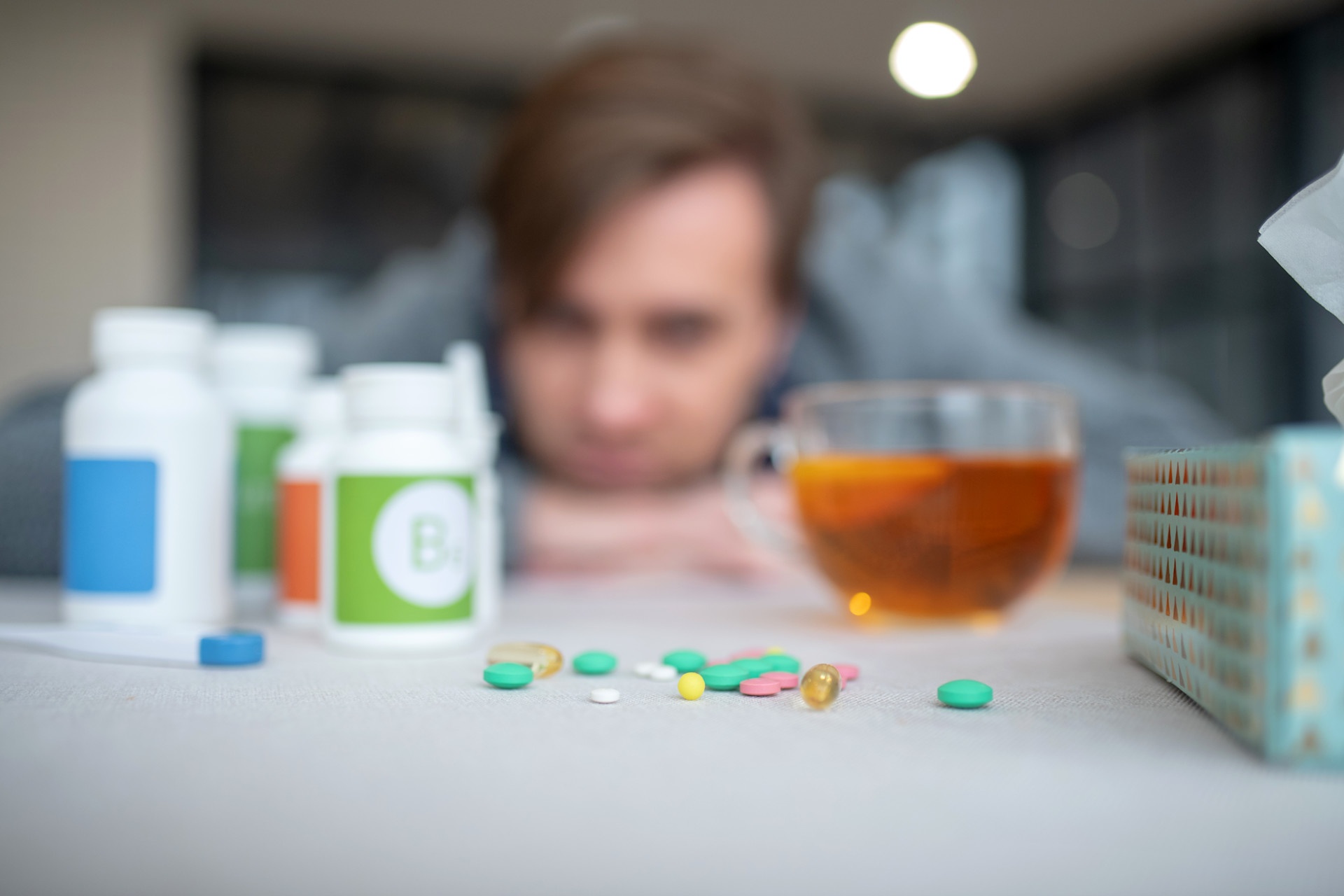 close-up-of-pills-lying-on-the-table-near-cup-benadryl-addiction
