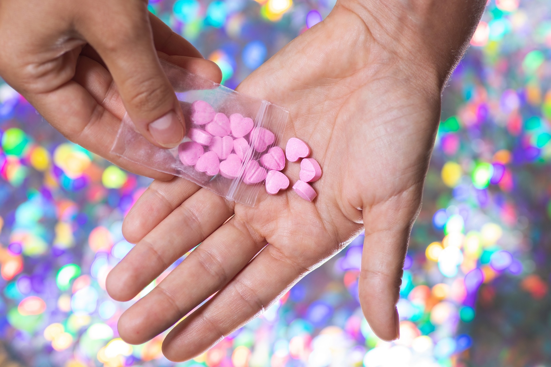 man-pouring-heart-shaped-pills-on-palm-from-ziploc-2024-10-16-09-12-39-utc