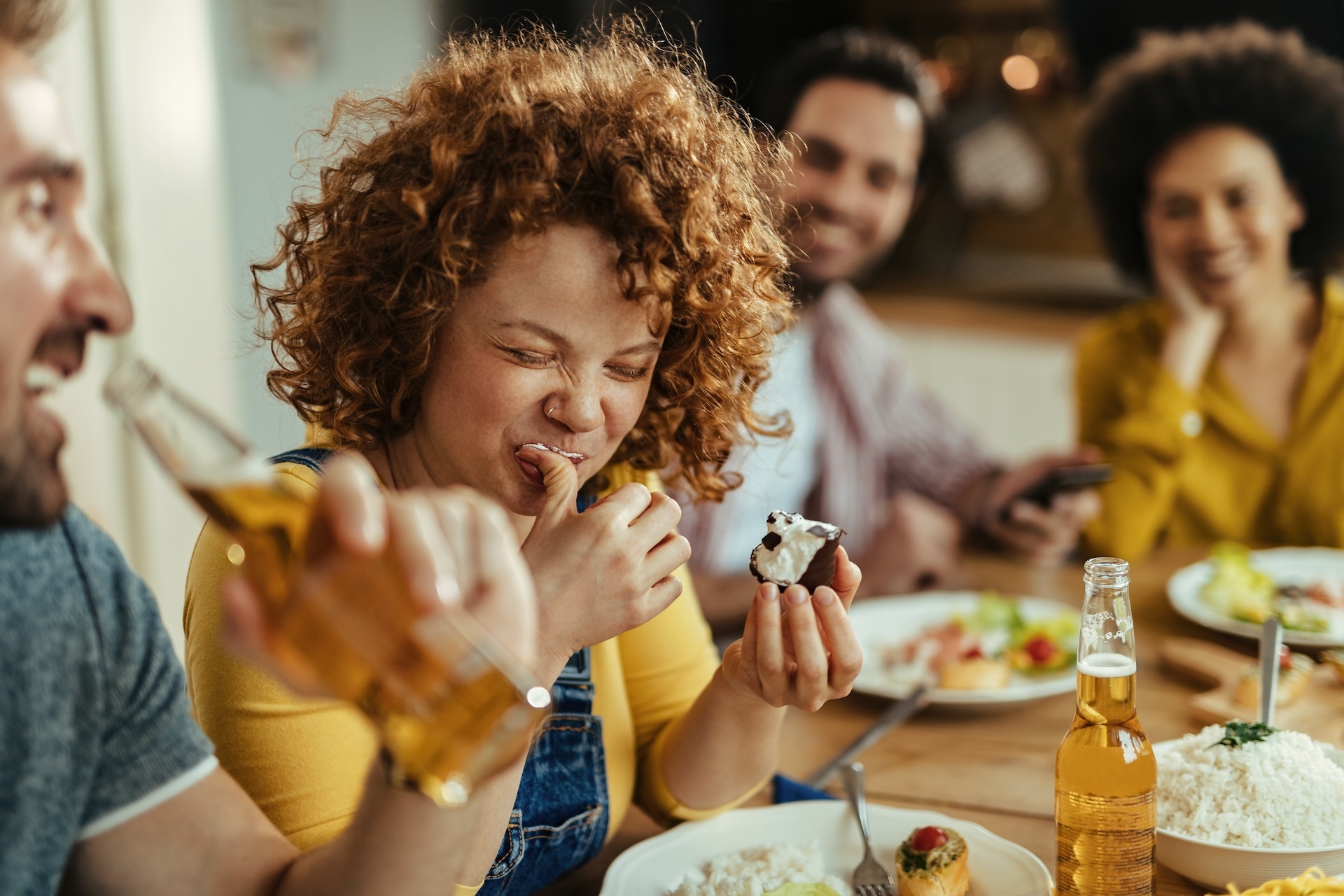 young-woman-having-fun-while-eating-dessert-after-2024-12-13-22-03-50-utc
