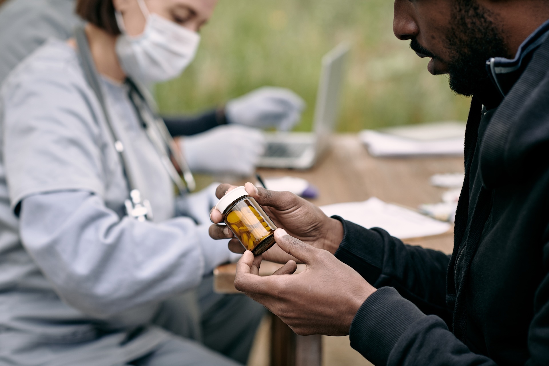 young-sick-man-holding-bottle-with-pills-prescribe-2023-11-27-05-22-59-utc