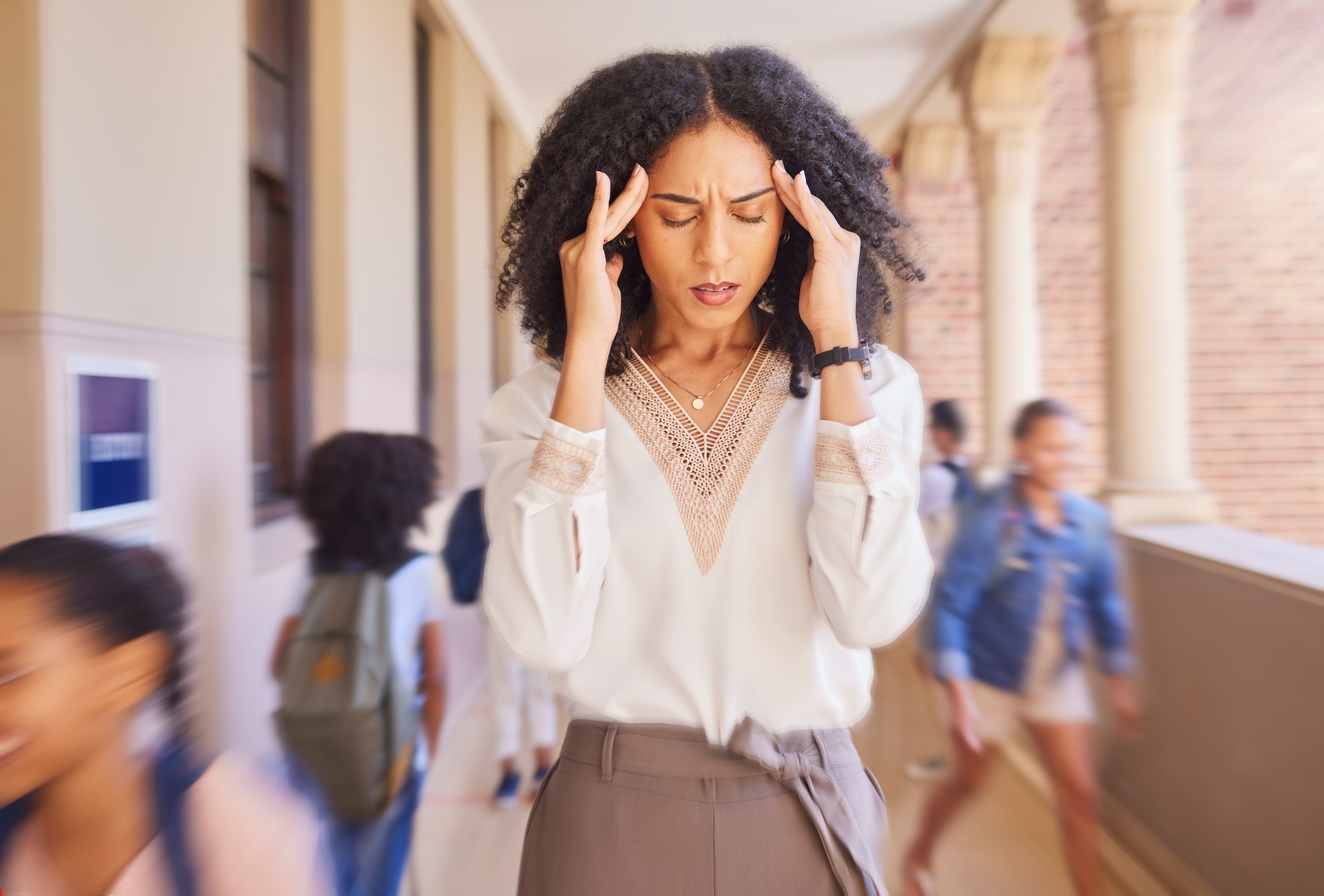 headache-tired-and-stress-teacher-in-school-with-2023-11-27-05-25-16-utc