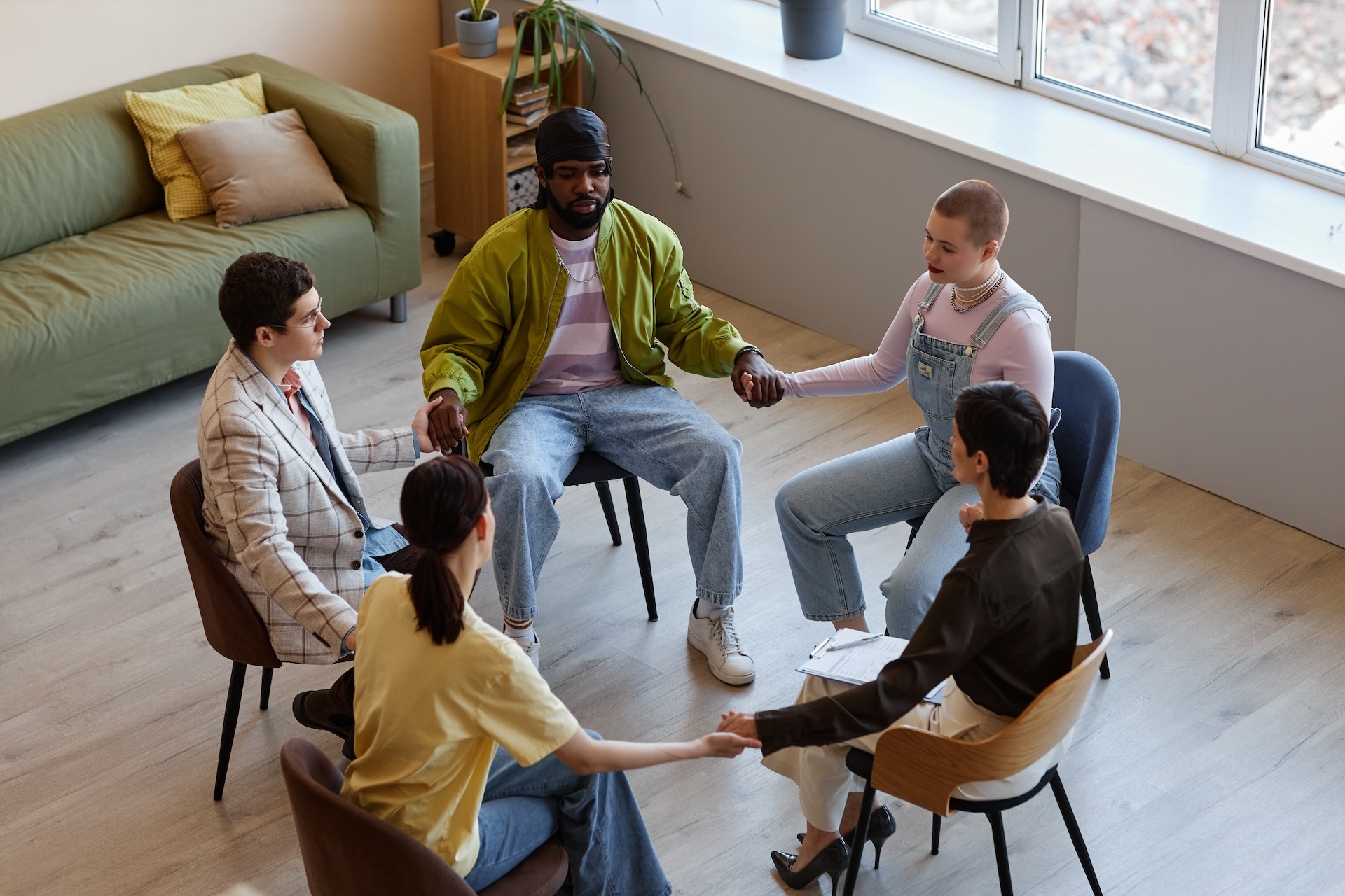 group-of-people-sitting-at-psychotherapy-session-2023-11-27-05-21-50-utc