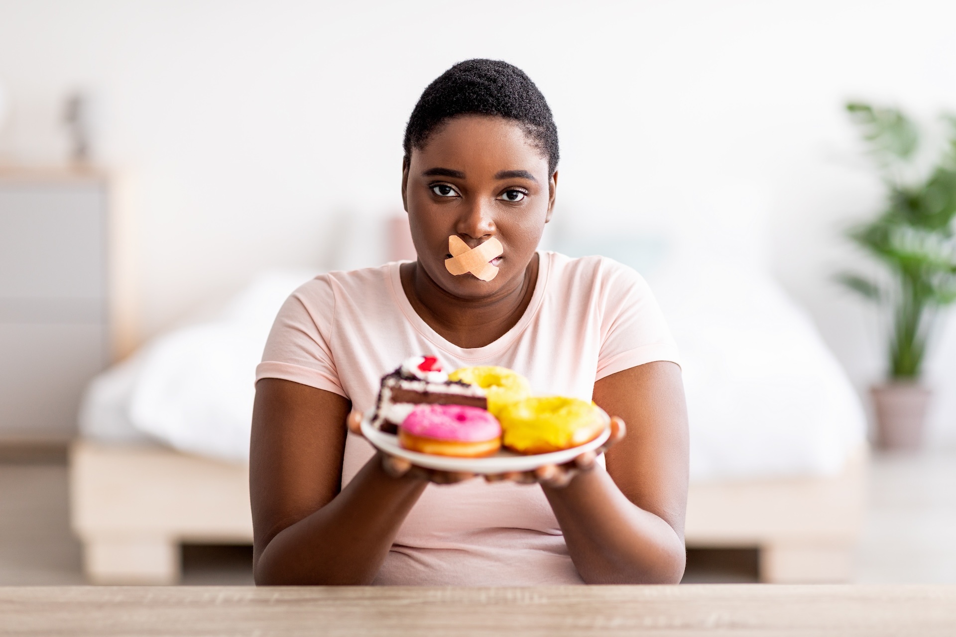 hungry-plus-size-black-woman-having-weight-loss-di-2023-11-27-05-06-53-utc