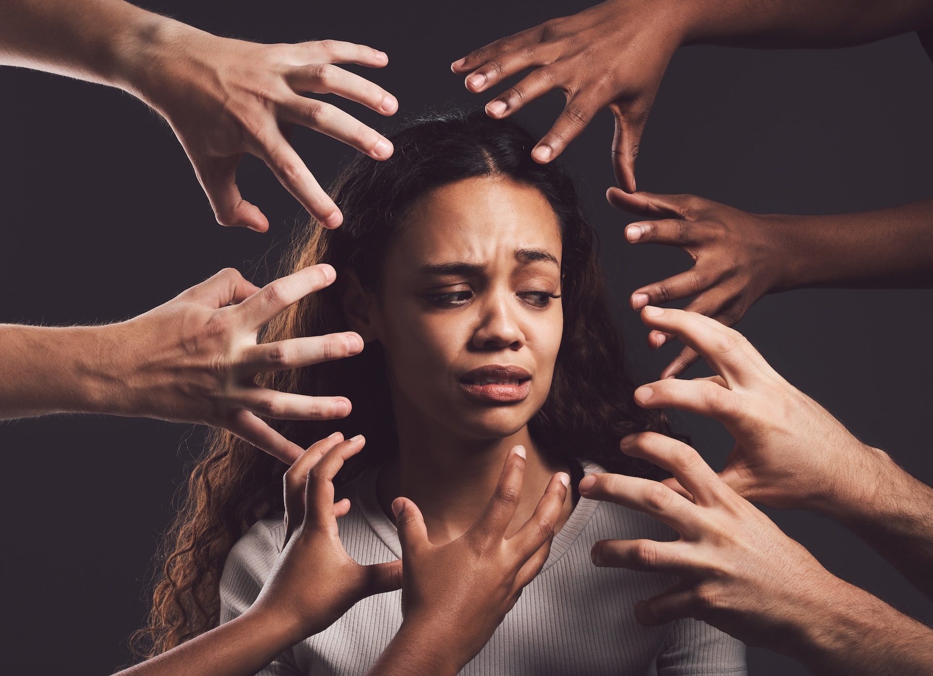 shot-of-hands-grabbing-a-young-womans-against-a-da-2023-11-27-05-37-03-utc