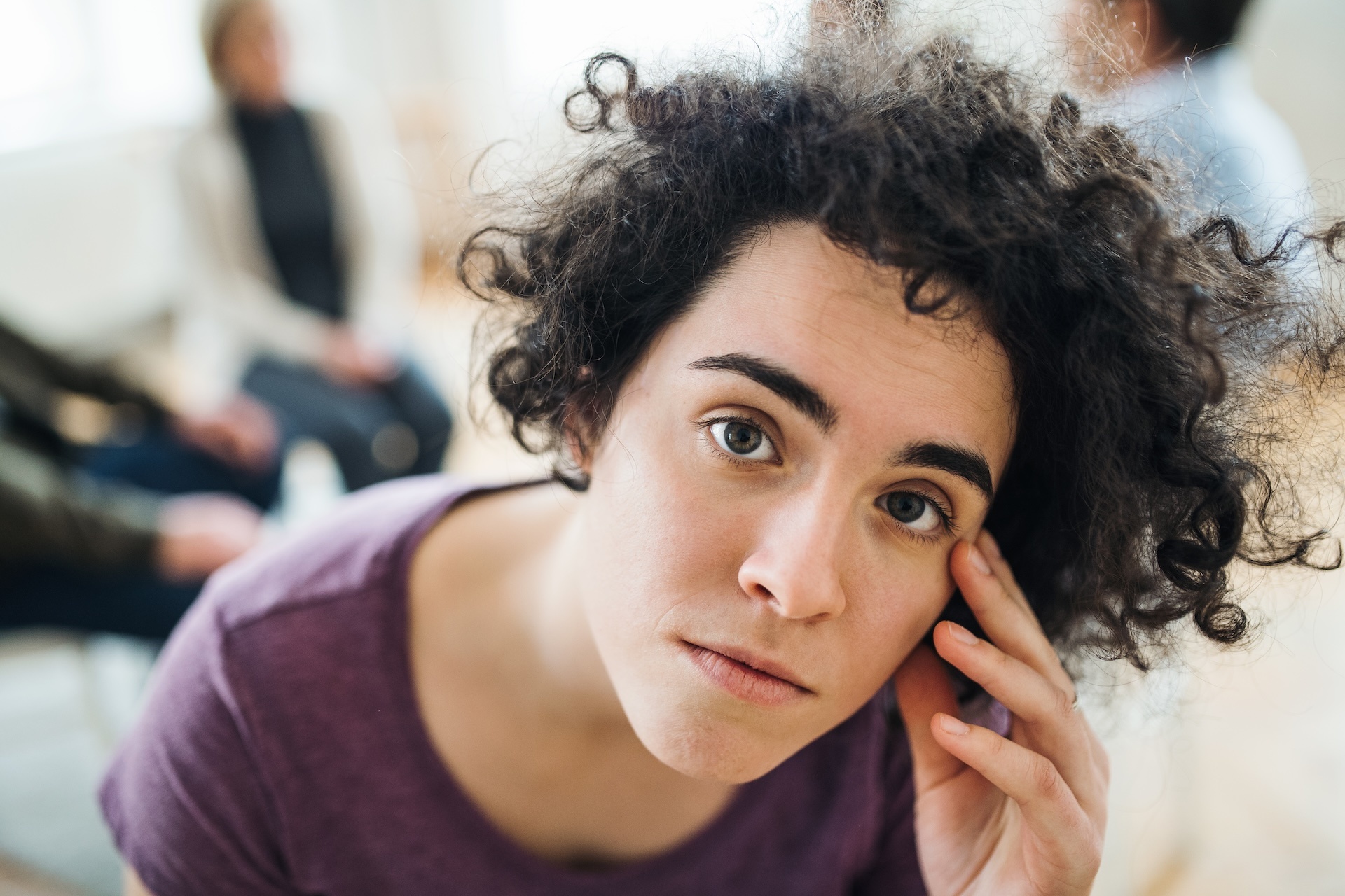 a-portrait-of-young-depressed-woman-during-group-t-2024-10-22-00-41-26-utc