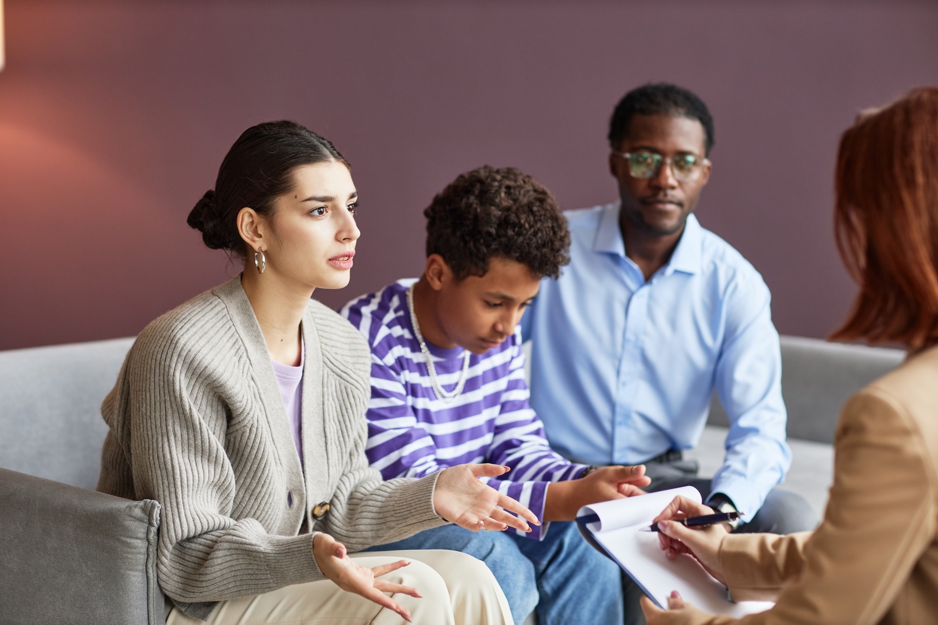 family-discussing-problems-with-psychologist-2023-11-27-05-30-31-utc