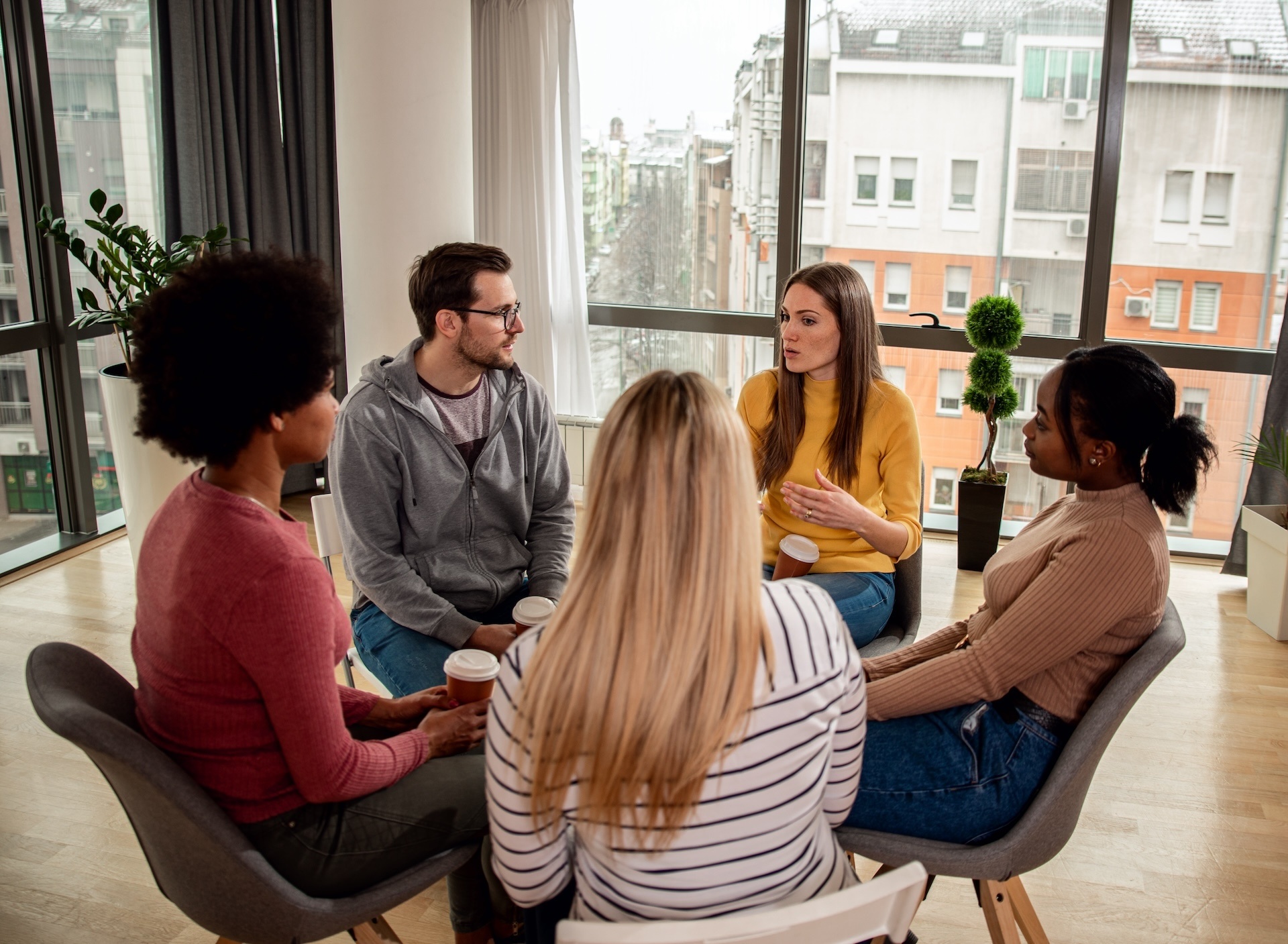 diverse-group-of-people-sitting-in-circle-in-group-2024-08-30-21-15-34-utc