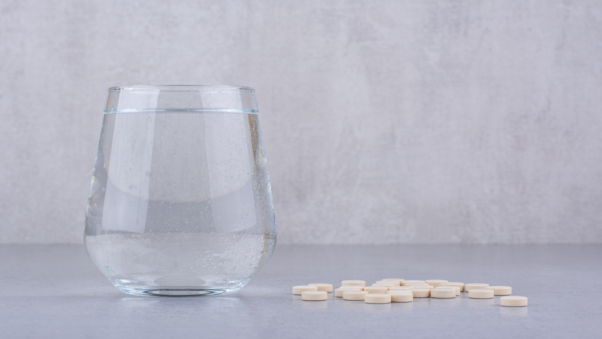 pharmaceutical-medicine-pills-and-glass-of-water-2023-11-27-05-07-57-utc (1)