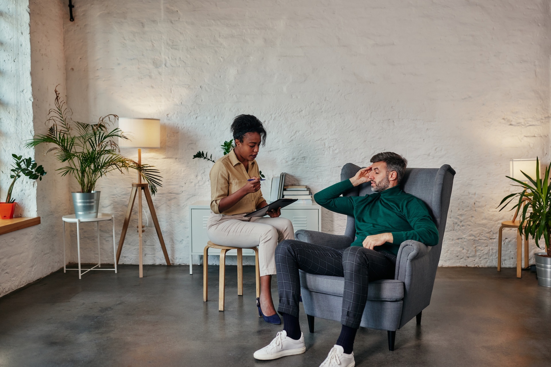 man-discusses-issues-with-african-female-therapist-2024-10-18-05-36-53-utc